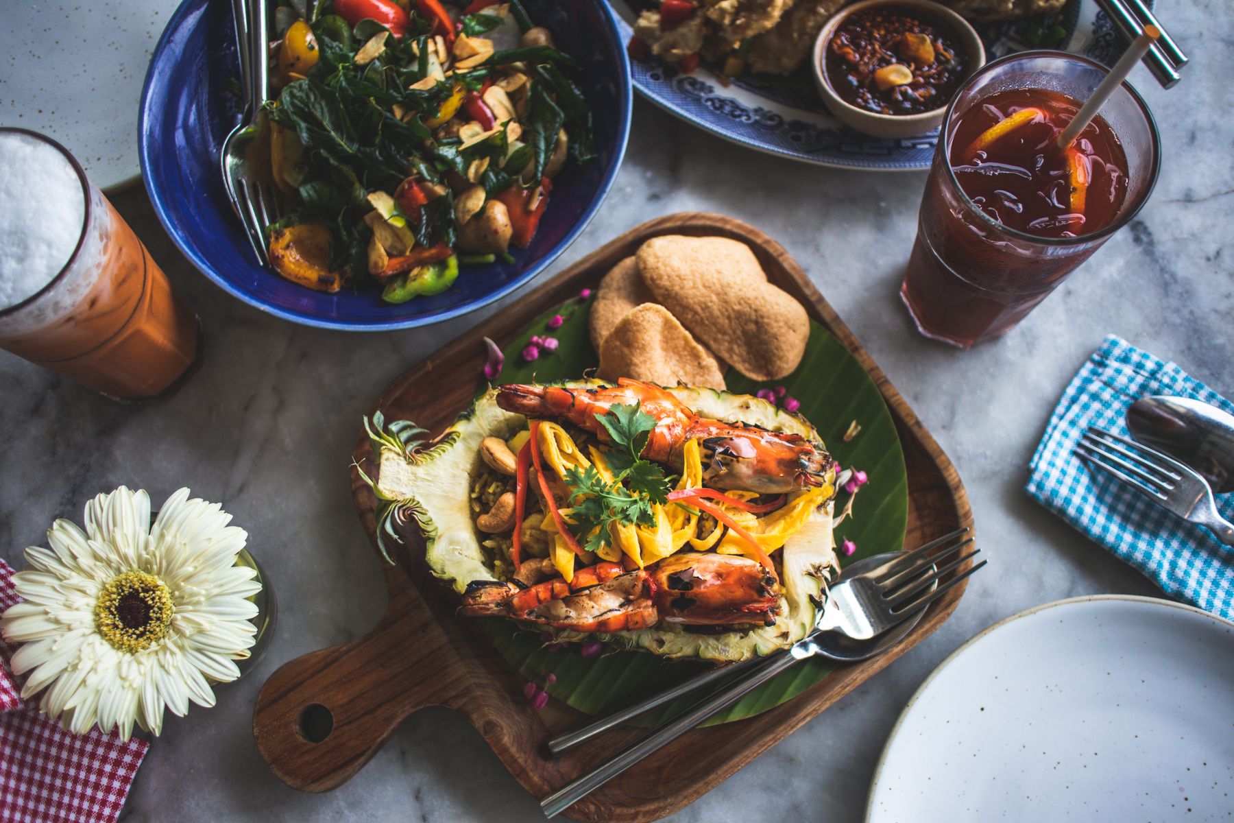 Assorted Thai dishes on a wooden platter